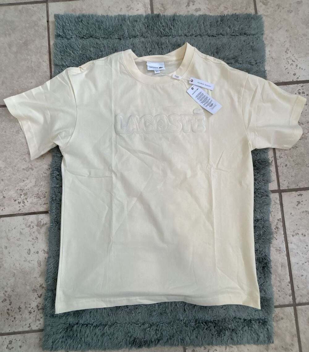 Lacoste Men's Classic Fit Embossed Logo Paris T-Shirt in Cream